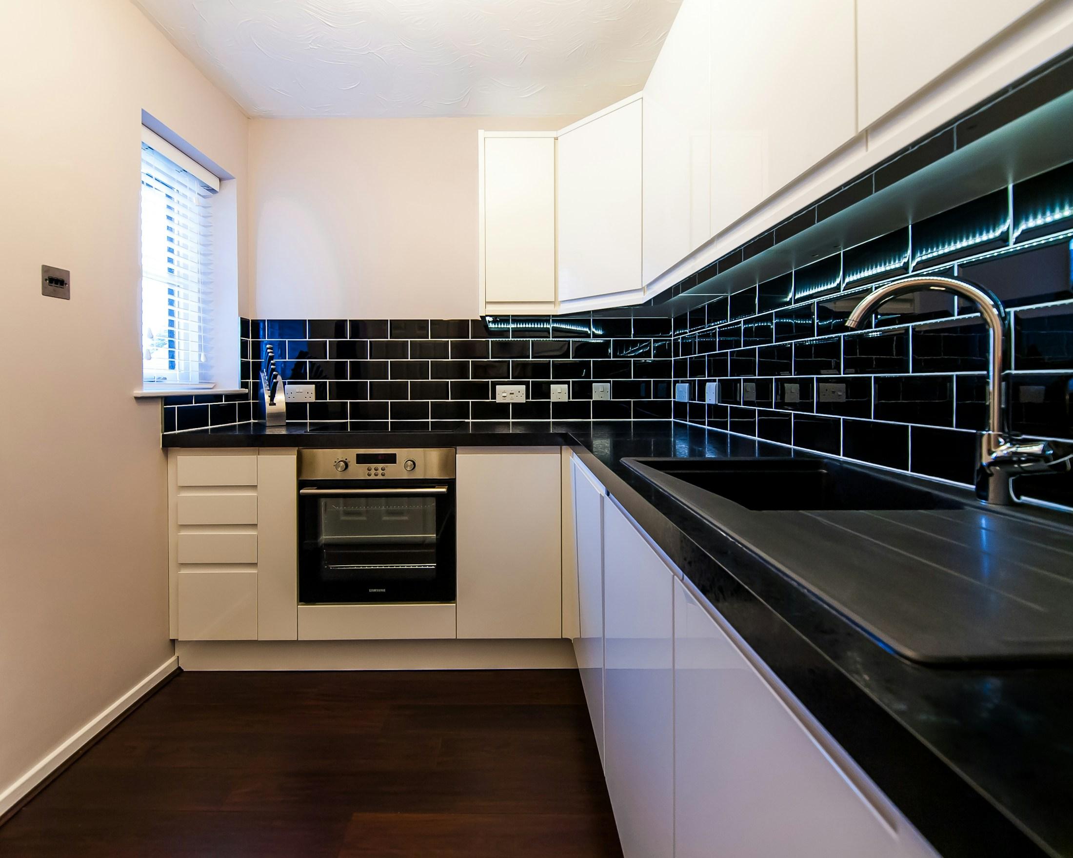 Finished contemporary kitchen with clean cabinetry and surfaces